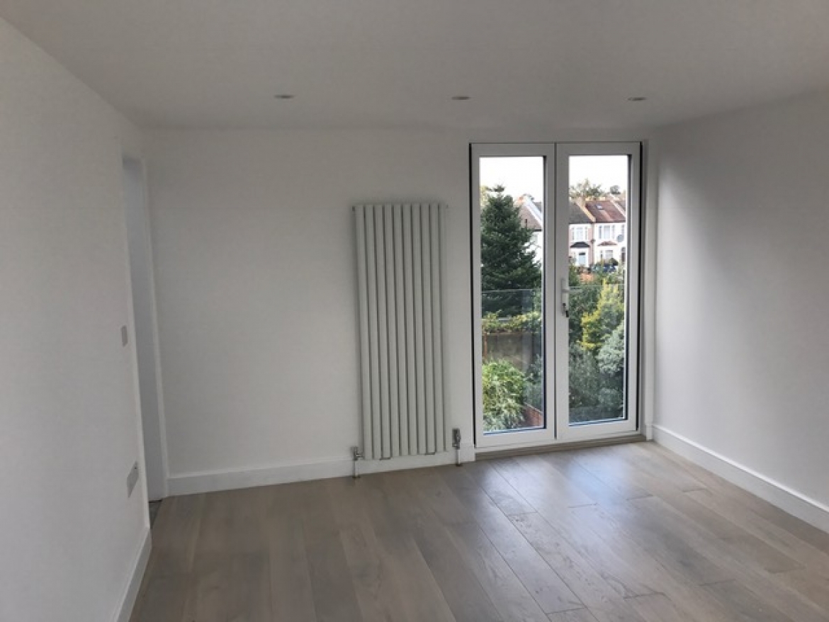 New dormer extension with an en-suite bathroom in North London completed by Decoracus