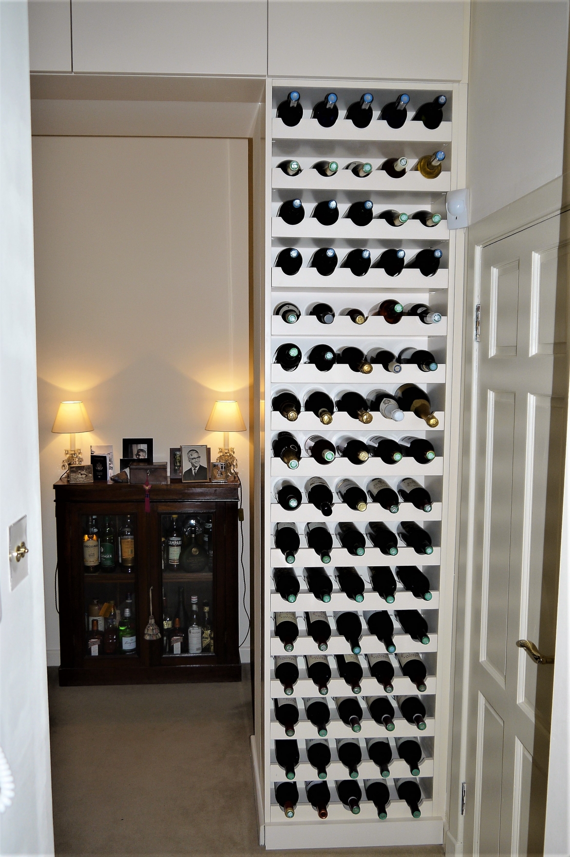 High End Flat Renovation In Central London. Decoracus carried out decoration work such as plastering the walls, painting, wallpapering, new floor installation, creating bespoke wine rack, bathroom installation and tiling 